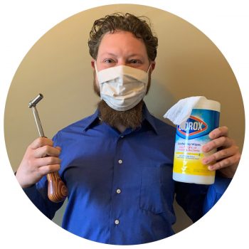 Photo of Josh with mask and sanitizing wipes